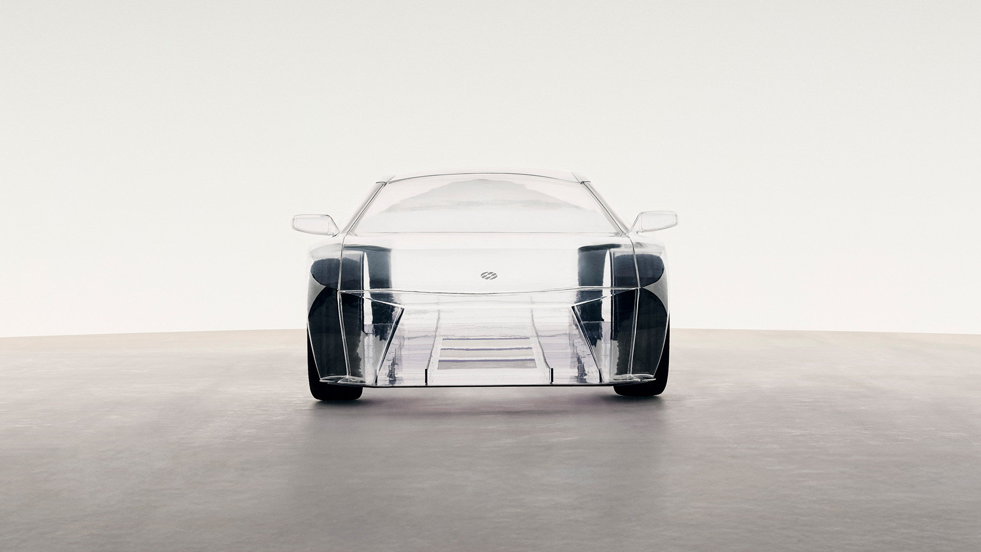 Front view of a transparent concept car showing internal structure and design.